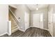 Inviting entryway with wood-look floors and a staircase at 10839 Cedar Pine Dr, Indianapolis, IN 46235