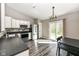 Well-lit kitchen featuring stainless steel appliances and dark countertops at 10839 Cedar Pine Dr, Indianapolis, IN 46235