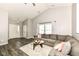 Comfortable living room with large windows, a sectional sofa and wood-look flooring at 10839 Cedar Pine Dr, Indianapolis, IN 46235