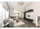 Open living room with vaulted ceiling, stylish furnishings and a ceiling fan at 10839 Cedar Pine Dr, Indianapolis, IN 46235