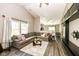 Cozy living room featuring a sectional sofa and neutral decor at 10839 Cedar Pine Dr, Indianapolis, IN 46235