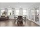 Bright dining area featuring a round table with seating for four, complemented by elegant french doors at 110 Washington St # 301, Indianapolis, IN 46204