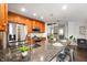 Well-lit kitchen with granite countertops, stainless steel appliances and bar stool seating at 110 Washington St # 301, Indianapolis, IN 46204