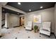 A lobby area featuring modern decor, tiled floor, neutral walls, and stylish seating at 110 Washington St # 301, Indianapolis, IN 46204