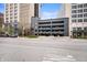 Street-level view of a parking garage with multiple levels and entrance/exit signage at 110 Washington St # 301, Indianapolis, IN 46204