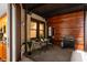 Outdoor patio with a table and chairs, wood accents, and a built-in grill at 110 Washington St # 301, Indianapolis, IN 46204