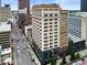 Aerial view of a tall building on a city street with cars and surrounding structures at 110 Washington St # 301, Indianapolis, IN 46204