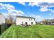 Expansive backyard showcasing a well-manicured lawn and an outdoor patio at 11631 Tamarisk Blvd, Fishers, IN 46037