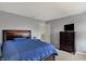 Bedroom featuring a comfortable bed, carpet floors, dresser and calming gray walls at 11631 Tamarisk Blvd, Fishers, IN 46037