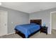 Bedroom featuring a comfortable bed, carpet floors, and calming gray walls at 11631 Tamarisk Blvd, Fishers, IN 46037
