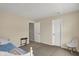 Cozy bedroom with a twin bed, complemented by neutral walls and carpet at 11631 Tamarisk Blvd, Fishers, IN 46037