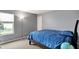 Bedroom featuring a comfortable bed, natural light, and calming gray walls at 11631 Tamarisk Blvd, Fishers, IN 46037