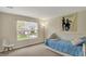 Cozy bedroom featuring a twin bed, large window, and neutral decor at 11631 Tamarisk Blvd, Fishers, IN 46037