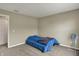 Clean bedroom with carpet floors and a comfortable twin bed at 11631 Tamarisk Blvd, Fishers, IN 46037