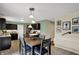 Eat-in kitchen with easy access to the dining area and featuring a wall decorated with art at 11631 Tamarisk Blvd, Fishers, IN 46037