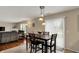 Cozy dining area with pendant lighting, adjacent to the sliding glass door and living area at 11631 Tamarisk Blvd, Fishers, IN 46037