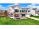 Two-story brick and vinyl home with blue shutters, attached garage, and professionally landscaped front yard at 11631 Tamarisk Blvd, Fishers, IN 46037