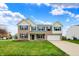 Beautiful two-story brick home with blue shutters, well-manicured lawn and attached two-car garage at 11631 Tamarisk Blvd, Fishers, IN 46037