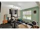 Bright home gym with natural light, weightlifting equipment and motivation banner at 11631 Tamarisk Blvd, Fishers, IN 46037