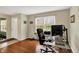 Comfortable home office with hardwood floors, a bright window, and neutral wall paint at 11631 Tamarisk Blvd, Fishers, IN 46037