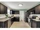 Beautiful kitchen with granite countertops, stainless steel appliances, and dark cabinets at 11631 Tamarisk Blvd, Fishers, IN 46037