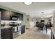 Spacious kitchen boasts stainless steel appliances and a seamless flow to the dining and living areas at 11631 Tamarisk Blvd, Fishers, IN 46037