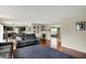 Open concept living room showcasing the flow between the kitchen, dining, and living areas at 11631 Tamarisk Blvd, Fishers, IN 46037