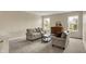 Cozy living room bathed in natural light, offering comfortable seating and serene views at 11631 Tamarisk Blvd, Fishers, IN 46037