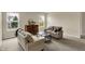 Well-lit living room offers comfortable seating, bright windows and neutral paint at 11631 Tamarisk Blvd, Fishers, IN 46037