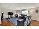 Comfortable living room with hardwood floors, fireplace, a blue rug and cozy seating at 11631 Tamarisk Blvd, Fishers, IN 46037