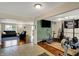 Open-concept living area transitions from living room to gym, perfect for modern living at 11631 Tamarisk Blvd, Fishers, IN 46037