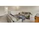 A cozy loft featuring neutral walls, comfortable seating and a coffee table with natural light shining in at 11631 Tamarisk Blvd, Fishers, IN 46037