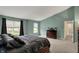 This main bedroom features plush carpet, neutral paint, and lots of natural light at 11631 Tamarisk Blvd, Fishers, IN 46037