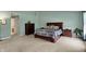Large main bedroom with plush carpet, complimented by abundant natural light and neutral wall colors throughout at 11631 Tamarisk Blvd, Fishers, IN 46037