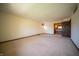 A vacant bedroom with neutral carpet and natural light from a large window at 130 Governors Ln, Zionsville, IN 46077