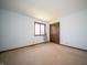 This bedroom features a window, door, and a carpeted floor at 130 Governors Ln, Zionsville, IN 46077