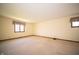 Spacious bedroom with carpet flooring and natural light from the large window at 130 Governors Ln, Zionsville, IN 46077