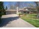 Spacious home featuring an attached two-car garage and stone and siding exterior at 130 Governors Ln, Zionsville, IN 46077