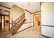 Open home foyer with staircase, chandelier, and entrances to other rooms at 130 Governors Ln, Zionsville, IN 46077