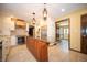 Well-lit kitchen featuring a spacious island, stainless steel appliances, and custom cabinetry at 130 Governors Ln, Zionsville, IN 46077
