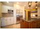 Spacious kitchen featuring stainless steel appliances, custom cabinets, and tile flooring at 130 Governors Ln, Zionsville, IN 46077