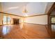 Spacious living room featuring hardwood floors, fireplace, chandelier, and bright windows at 130 Governors Ln, Zionsville, IN 46077