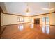 Large living room featuring hardwood floors, fireplace, chandelier, and bright windows at 130 Governors Ln, Zionsville, IN 46077