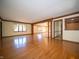 Spacious living room boasts hardwood floors, wood trim, and large windows for natural light at 130 Governors Ln, Zionsville, IN 46077