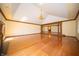 Hardwood flooring in a bright living room with fireplace, chandelier, and beautiful trim at 130 Governors Ln, Zionsville, IN 46077