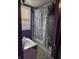 Bathroom featuring a shower/tub combo with curtain, a sink, and window at 1343 W 33Rd St, Indianapolis, IN 46208
