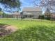 A tranquil backyard with a pool, black fence, and green trees at 1394 Cherry Tree Rd, Avon, IN 46123
