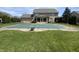 Expansive backyard featuring a covered pool, well-manicured lawn, and established landscaping at 1394 Cherry Tree Rd, Avon, IN 46123