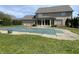 Spacious backyard featuring an in-ground pool, a well-manicured lawn, and mature trees at 1394 Cherry Tree Rd, Avon, IN 46123