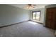 Bedroom with neutral carpet and trim and natural lighting from the window at 1394 Cherry Tree Rd, Avon, IN 46123